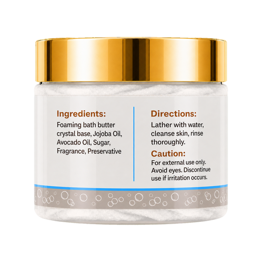 A jar of foaming bath butter with a shiny gold lid and a white label showing ingredients and directions, set against a plain white background.