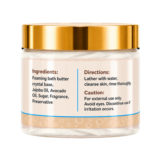 Foaming bath butter in a clear jar with a metallic gold lid and a beige label containing product instructions and ingredients.