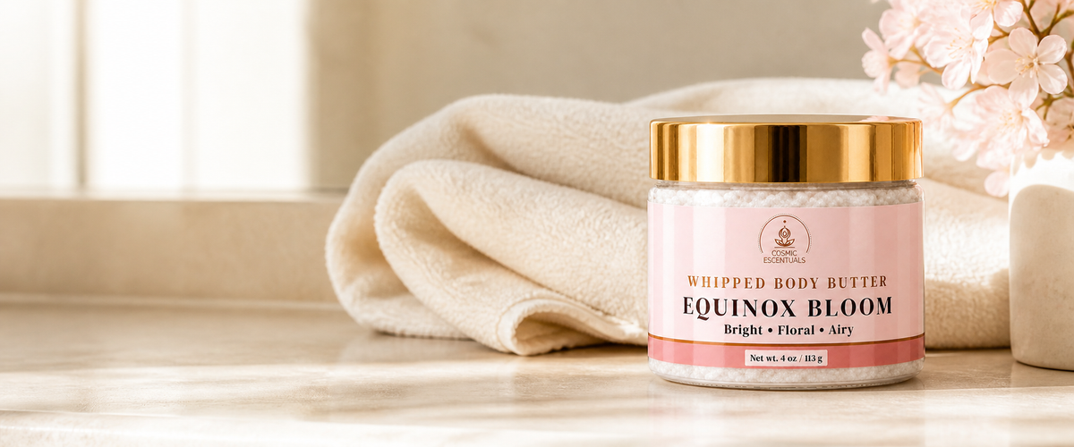Cosmic Essentials Whipped Body Butter in Nova Rose, a 4 oz jar with a metallic gold lid and a pale pink label, shown on a white background.