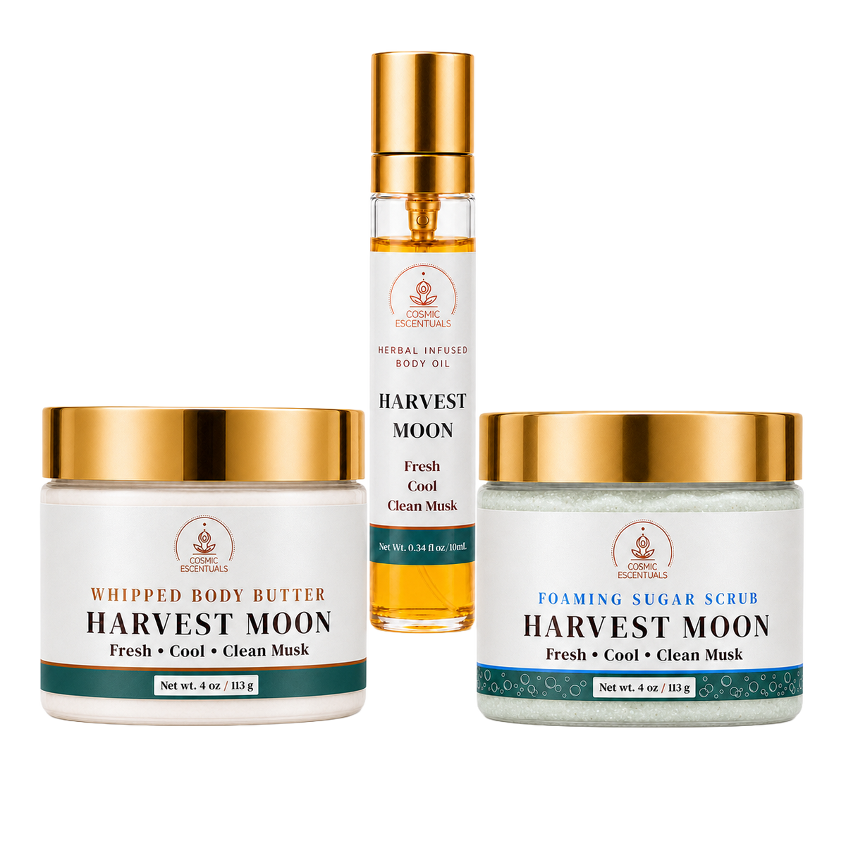 Three skincare products from the Harvest Moon line by Cosmic Escentuals arranged on a white background: a whipped body butter jar, a foaming sugar scrub jar, and a body oil spray bottle.