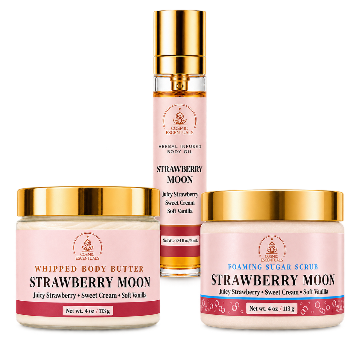 Cosmic Escentuals 'Strawberry Moon' skincare products arranged on a white background: a body oil bottle, a whipped body butter jar, and a foaming sugar scrub jar. The products feature pink labels with gold caps.