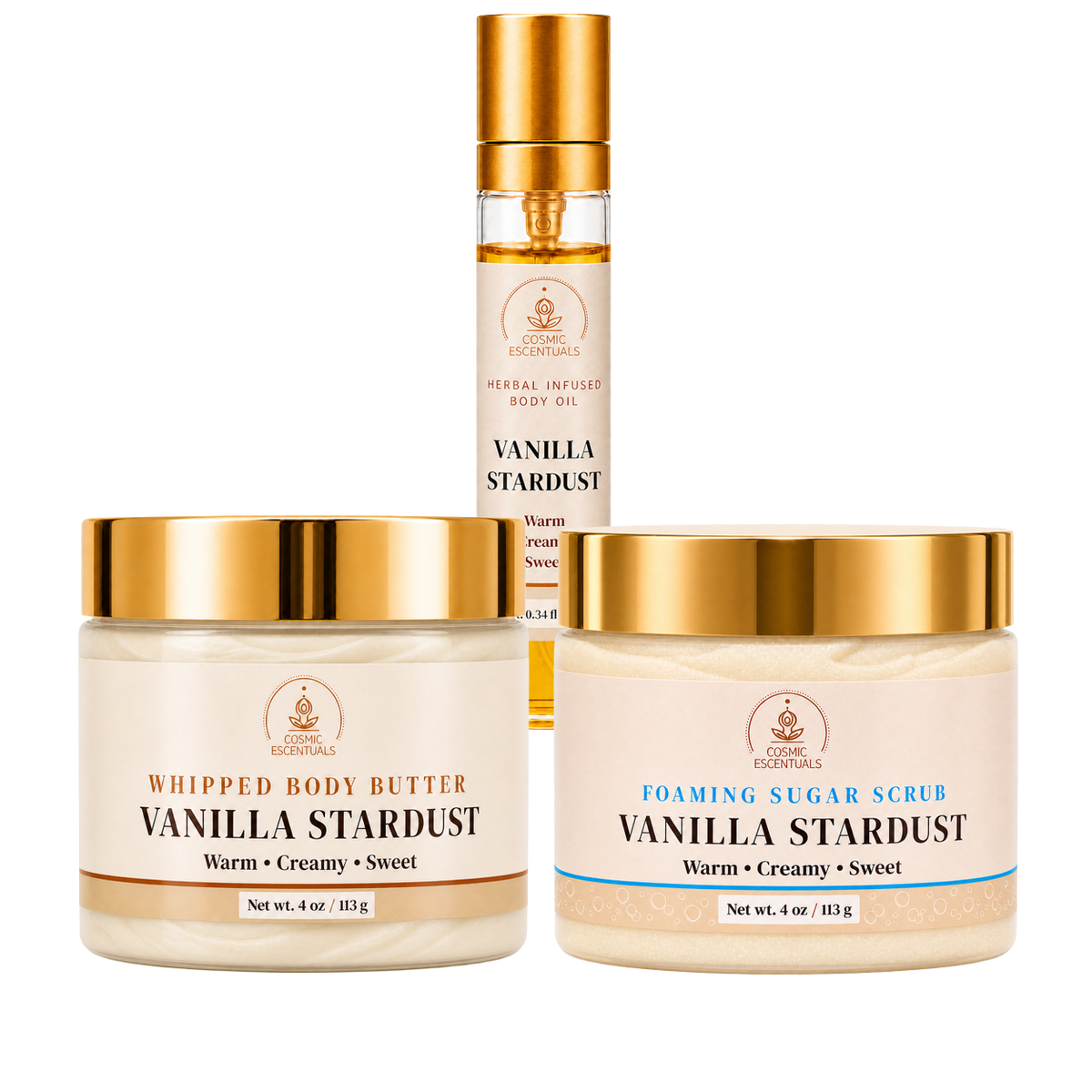 Three skincare products from Cosmic Escentuals on a white background: a whipped body butter jar, a foaming sugar scrub jar, and a body oil bottle, all labeled Vanilla Stardust.