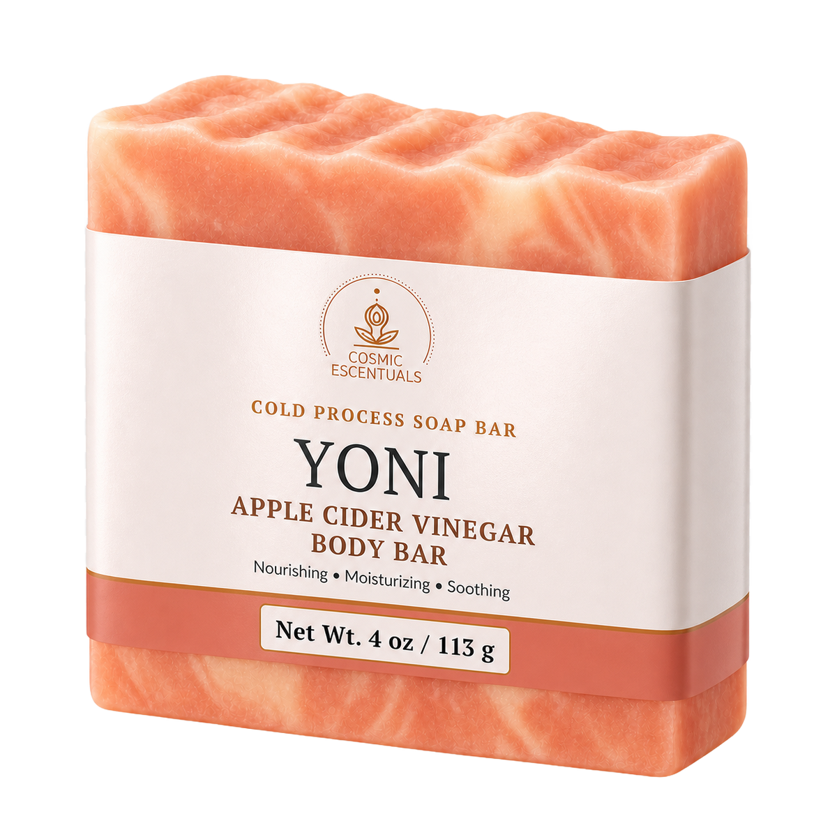 A single bar of Cosmic Escentuals Yoni Apple Cider Vinegar Body Bar soap, shown in a peachy-orange color with a white paper label band around the middle, on a solid white background.