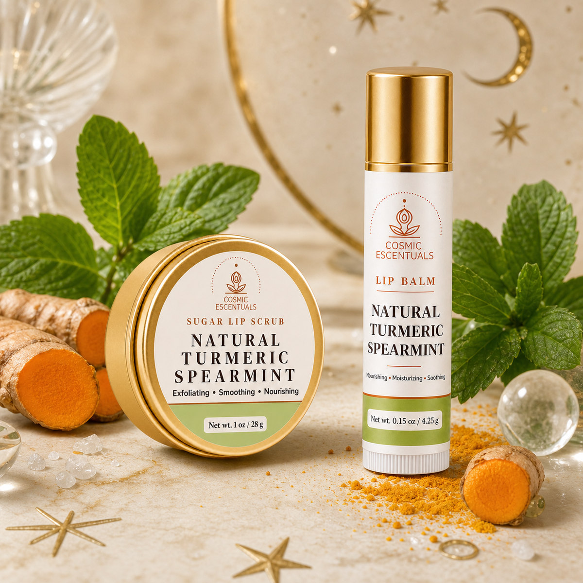 Cosmic Essentials Natural Turmeric Spearmint lip scrub in a round gold tin and lip balm in a slim gold-and-white tube, styled with fresh mint leaves, turmeric root, and scattered turmeric powder on a light beige surface with gold star decorations.