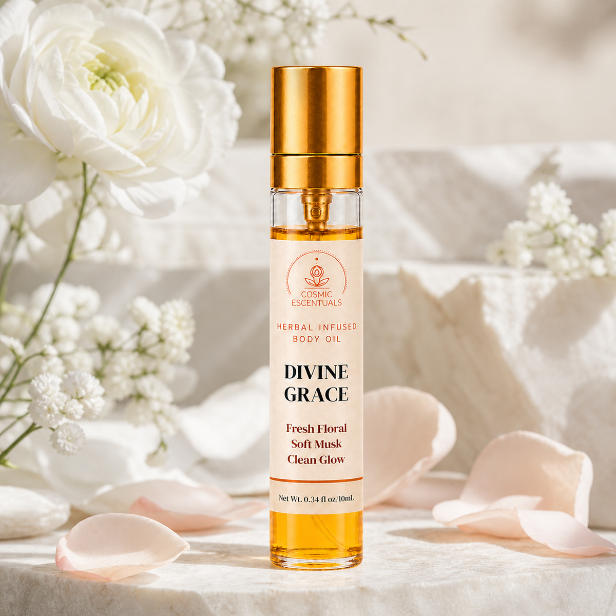 Divine Grace Herbal Body Oil Spray on a pale stone surface, styled with white ranunculus, baby's breath and scattered blush petals.
