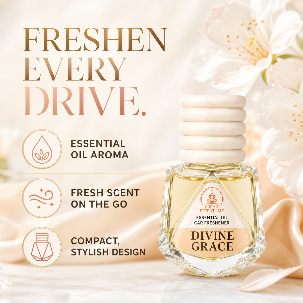 A car freshener bottle labeled 'DIVINE GRACE' by Cosmic Escentuals, shown on a soft beige background with floral imagery and marketing text. The bottle contains pale yellow liquid and has a stacked white cap.