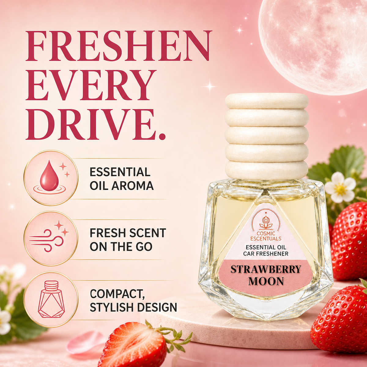A bottle of Cosmic Escentuals Strawberry Moon essential oil car freshener shown on a pink promotional background with strawberries, flowers, and text highlighting fresh scent and compact design.