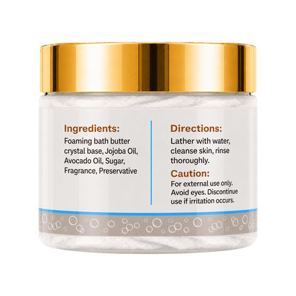 A jar of foaming bath butter with a shiny gold lid and a white label showing ingredients and directions, set against a plain white background.
