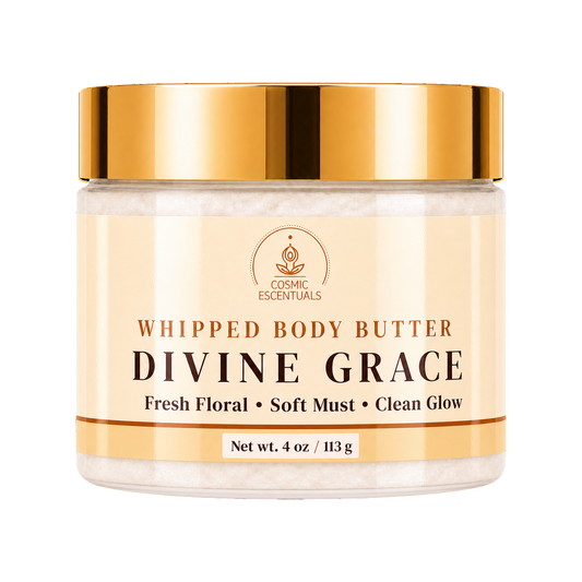 Cosmic Essentials Divine Grace Whipped Body Butter in a clear jar with a metallic gold lid and cream-colored label, set against a plain white background.