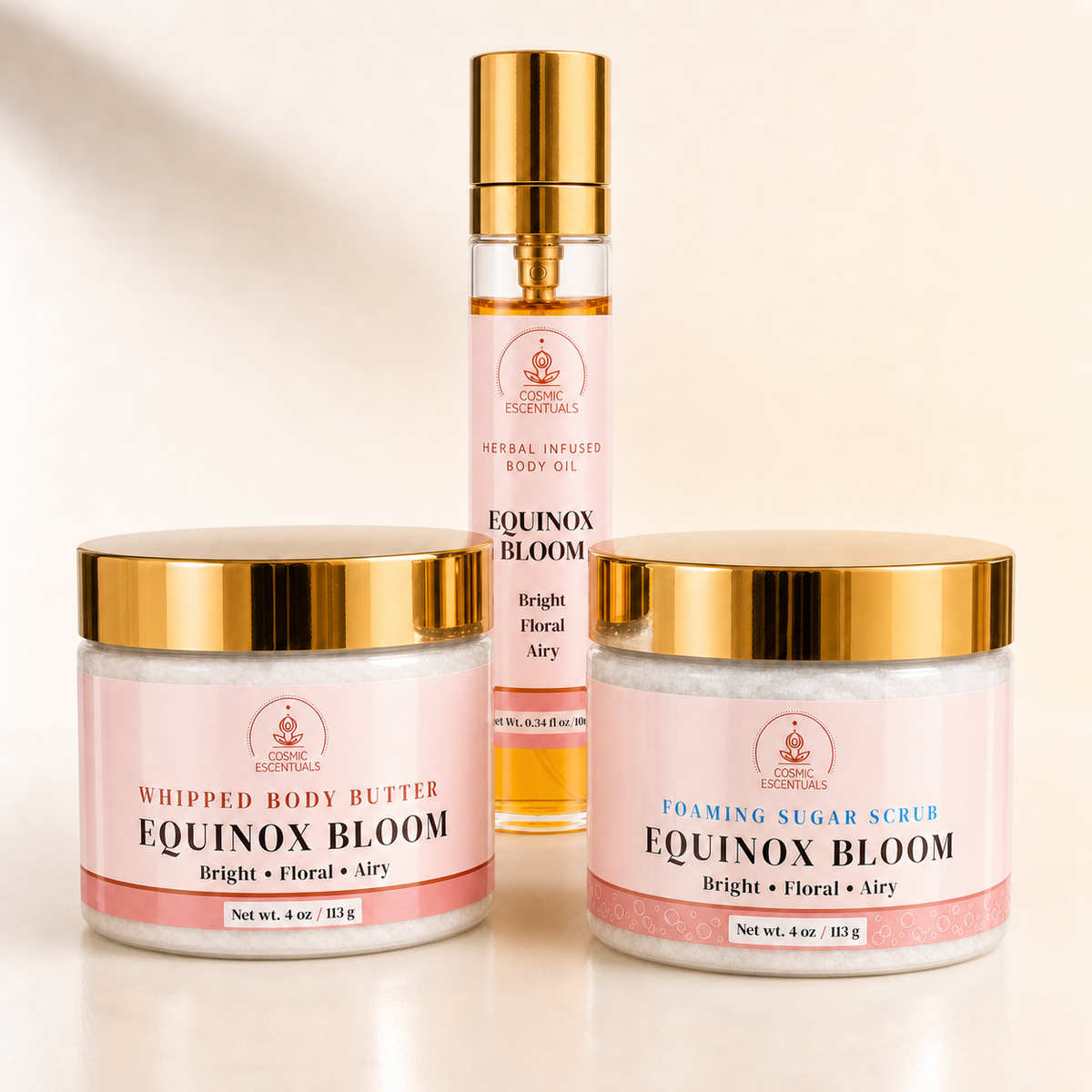Equinox Bloom Bundle featuring Whipped Body Butter, Foaming Sugar Scrub, and Herbal Body Oil Spray, arranged together on a plain white background.