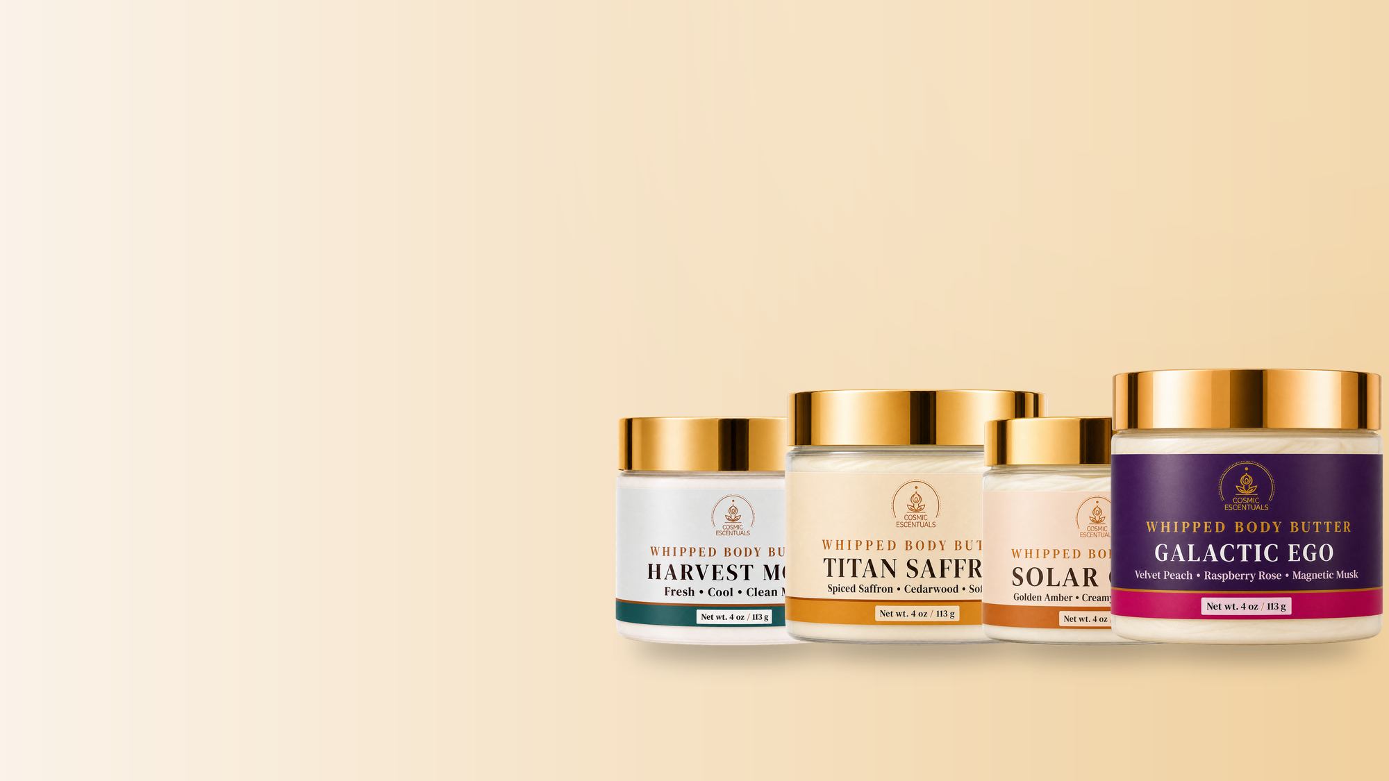 Harvest Moon, Titan Saffron, Solar Glow, and Galactic Ego whipped body butters on a warm golden background