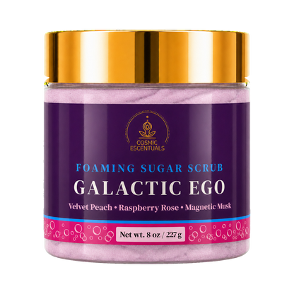 Cosmic Escentuals Foaming Sugar Scrub, Galactic Ego, 8oz jar with a shiny gold lid, shown on a plain white background.