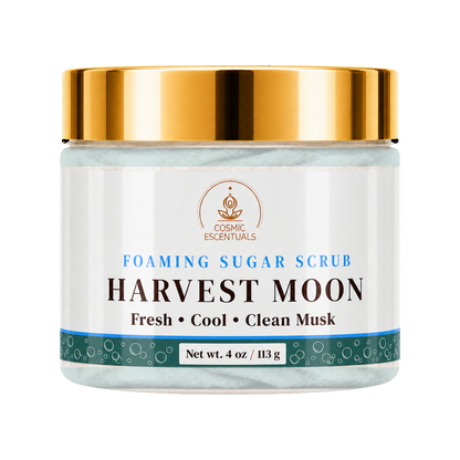 Cosmic Essentials Harvest Moon Foaming Sugar Scrub in a 4 oz jar with a shiny gold lid and a white label featuring blue and black text.