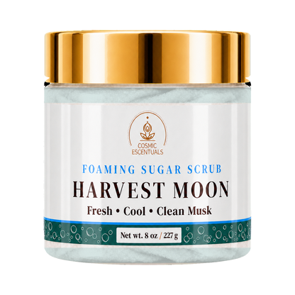 Cosmic Essentials Harvest Moon Foaming Sugar Scrub in an 8 oz jar with a white label, teal accents, and a shiny gold lid, set against a plain white background.