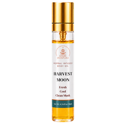 Cosmic Essentials Harvest Moon Herbal Infused Body Oil in a clear glass bottle with a gold cap, showing the golden oil inside, on a white background.
