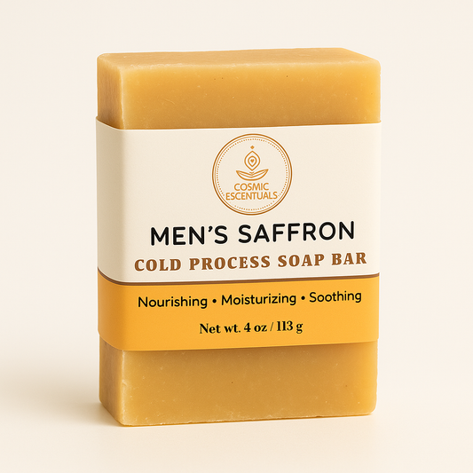 Men's saffron cold process soap bar with Cosmic Escentuals branding on a beige background