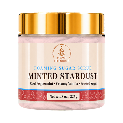 Cosmic Essentials Minted Stardust Foaming Sugar Scrub in an 8 oz jar with a shiny gold lid and cream-colored label.
