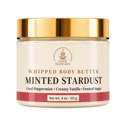 Cosmic Essentials Whipped Body Butter in Minted Stardust scent, in a 4 oz jar with a cream-colored label, a metallic gold lid, and a dusty rose accent band at the bottom.