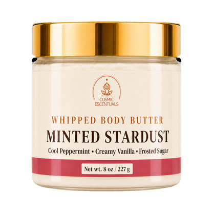 Cosmic Essentials Whipped Body Butter in Minted Stardust scent, in an 8 oz clear jar with a shiny gold lid and cream-colored label.