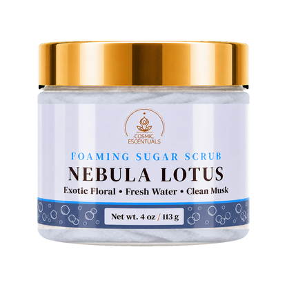 Cosmic Essentials Nebula Lotus Foaming Sugar Scrub in a 4 oz jar with a shiny gold lid and a white label featuring blue and black text.