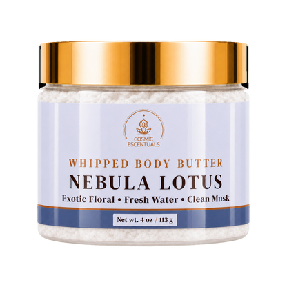 Cosmic Essentials Whipped Body Butter in Nebula Lotus scent, in a clear jar with a metallic gold lid and a light lavender label, on a white background.