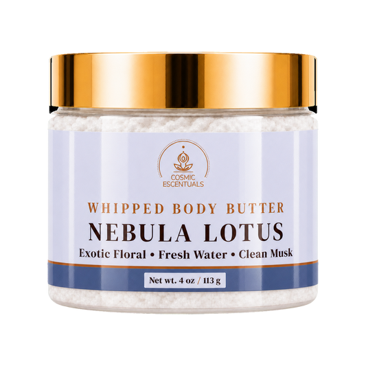 Cosmic Essentials Whipped Body Butter in Nebula Lotus scent, in a clear jar with a metallic gold lid and a light lavender label, on a white background.