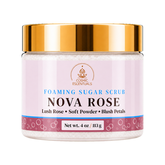 Cosmic Escentuals Nova Rose Foaming Sugar Scrub, 4oz jar with a shiny gold lid and a rose-pink label, on a plain white background.