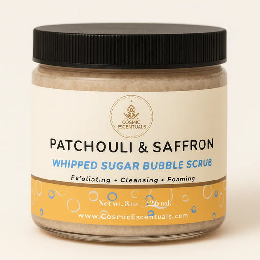 Jar of Patchouli & Saffron Whipped Sugar Bubble Scrub with a black lid on a beige background