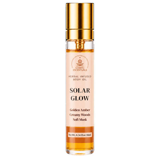 Cosmic Essentials Solar Glow Herbal Infused Body Oil in a clear glass bottle with a shiny gold cap, showing golden amber liquid inside, on a white background.