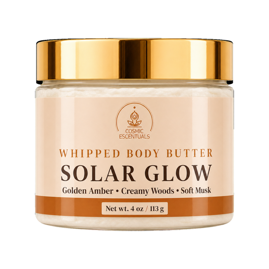 Cosmic Escentuals Solar Glow Whipped Body Butter, 4oz jar with a shiny gold lid and a beige label, on a plain white background.