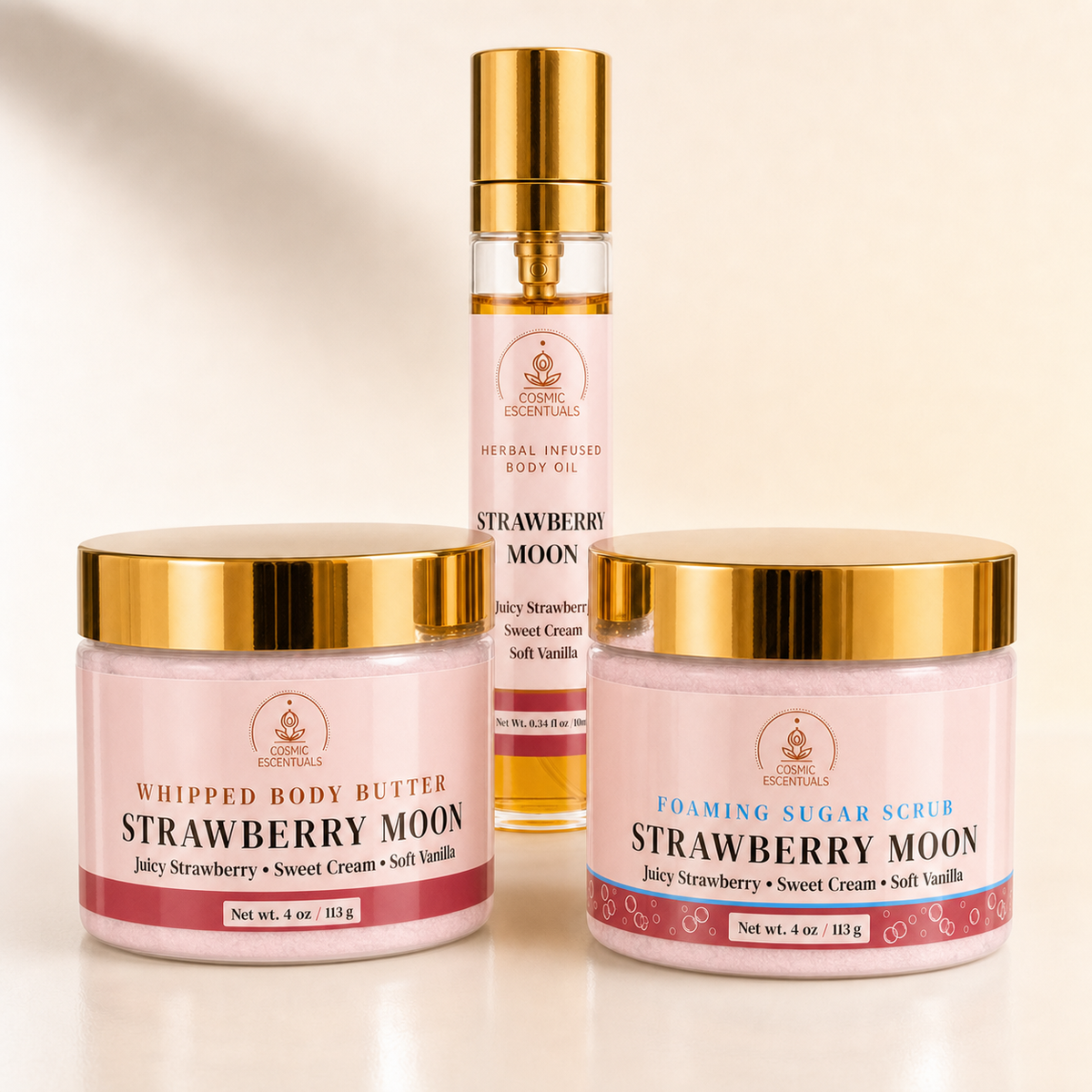 Strawberry Moon Bundle featuring Whipped Body Butter, Foaming Sugar Scrub and Herbal Body Oil Spray displayed together.