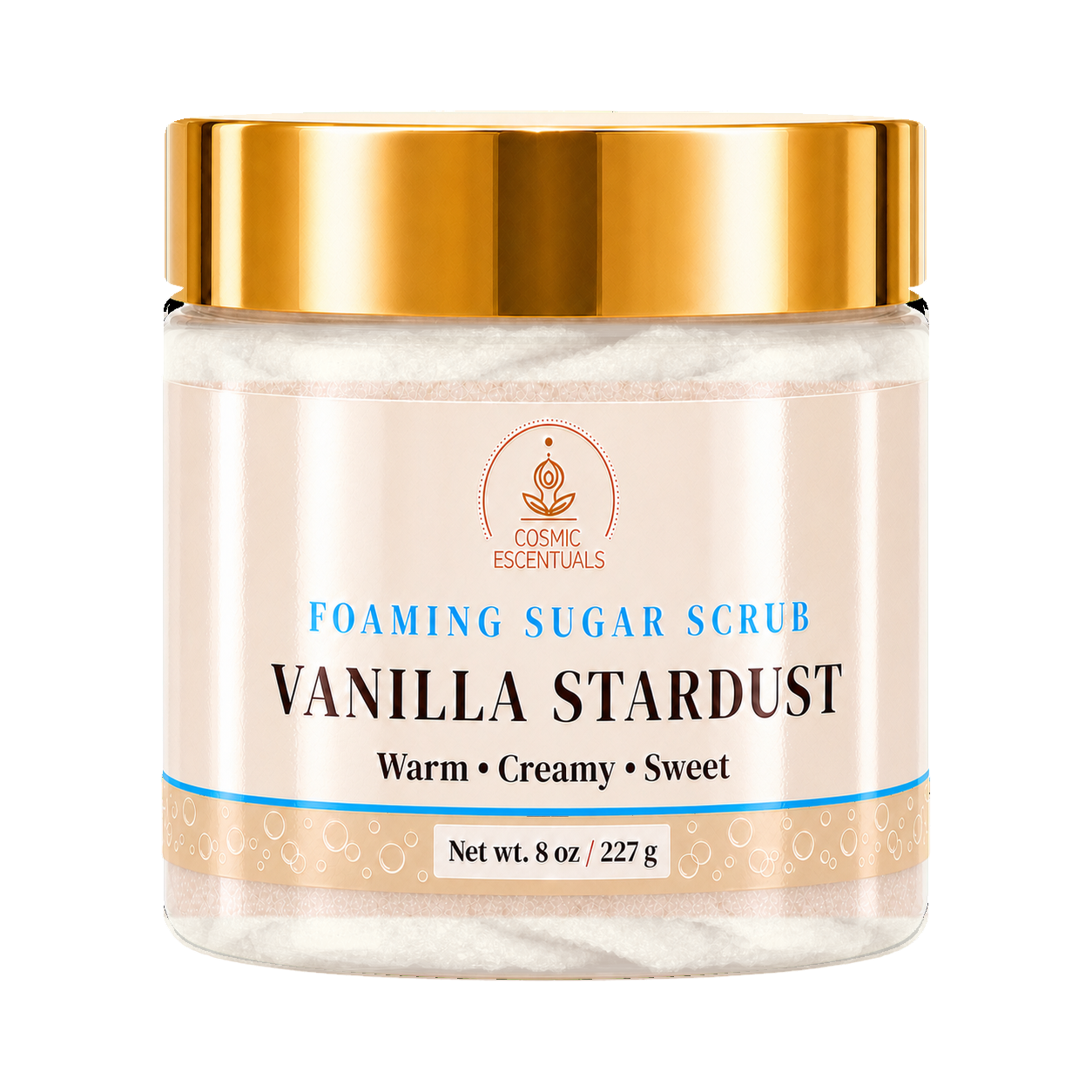A jar of Cosmic Essentials Vanilla Stardust Foaming Sugar Scrub, featuring a metallic gold lid and a cream-colored label with blue and black text, set against a plain white background.