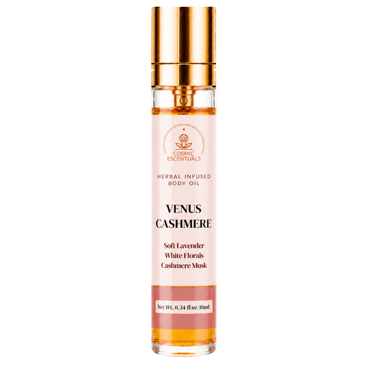 A 30ml glass bottle of COSMIC ESSENTIALS Venus Cashmere Herbal Infused Body Oil with a shiny gold cap, shown against a plain white background.