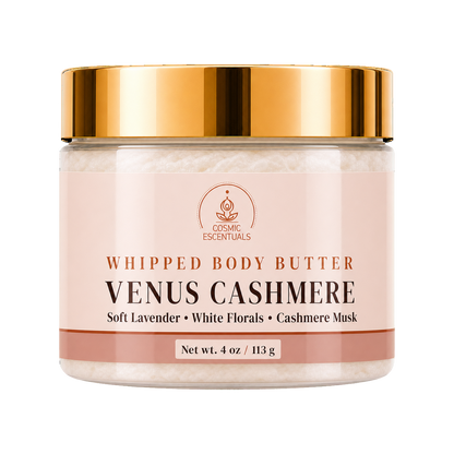 Cosmic Essentials Venus Cashmere Whipped Body Butter in a clear jar with a reflective gold lid and a pale pink label, shown on a white background.