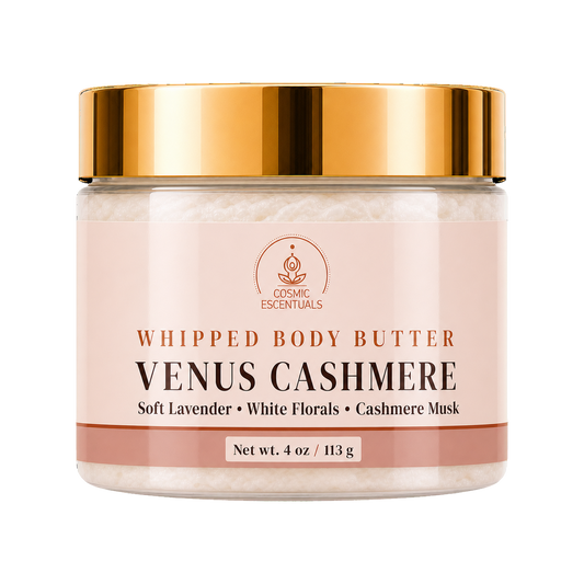 Cosmic Essentials Venus Cashmere Whipped Body Butter in a clear jar with a reflective gold lid and a pale pink label, shown on a white background.